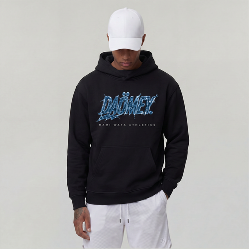 Person wearing a black hoodie with blue text on a plain background